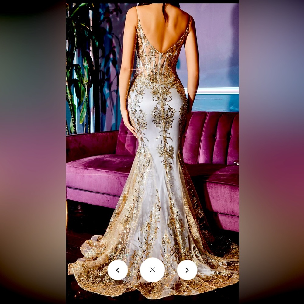 Prom dress size 4 in gold-mist color new with tags.